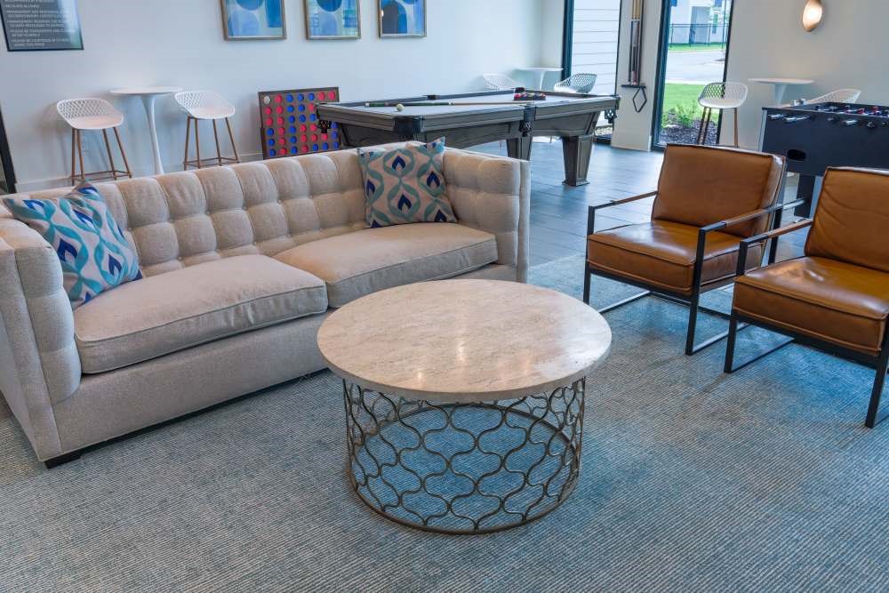 A living room with a sofa, chair, and coffee table.
