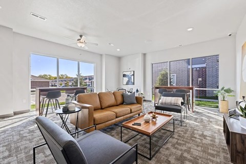A living room with a brown sofa and a coffee table.