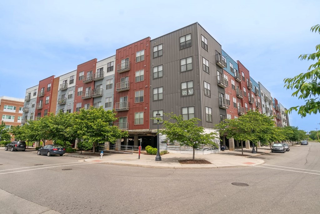 A large multi-story apartment building with a parking lot in front.at Century Bridges, Virginia, 24016
