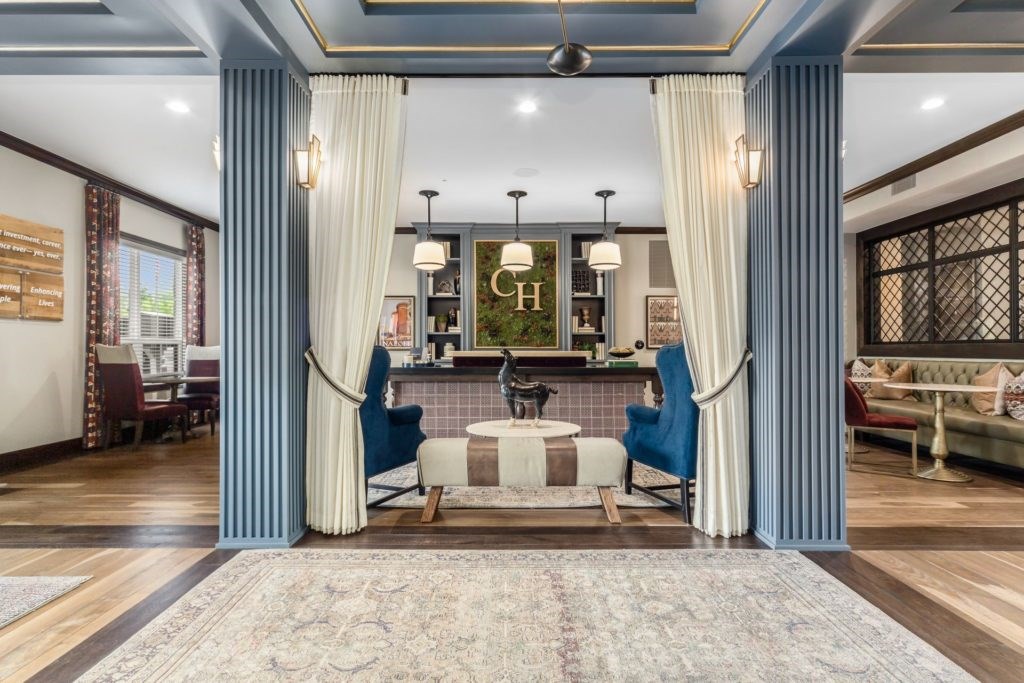 A living room with a blue and white color scheme.
