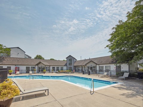 our apartments offer a swimming pool with our buildings in the background