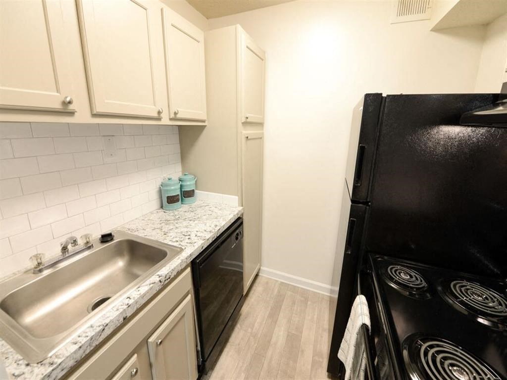 Kitchen with black appliances at the Grove at St. Andrews, Columbia, SC