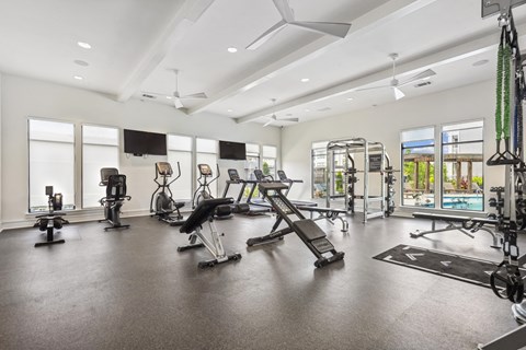 the gym with treadmills and weights at the grove at cottonwood apartments