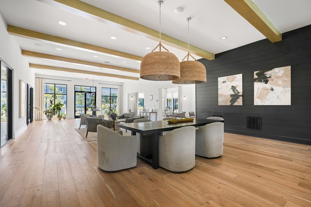 a large dining room with a large table and chairs and a living room