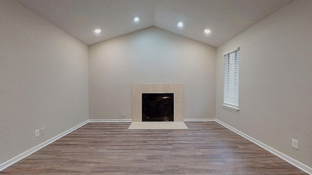 Large living room with faux wood flooring at Spalding Vue Apartments, Peachtree Corners, Georgia