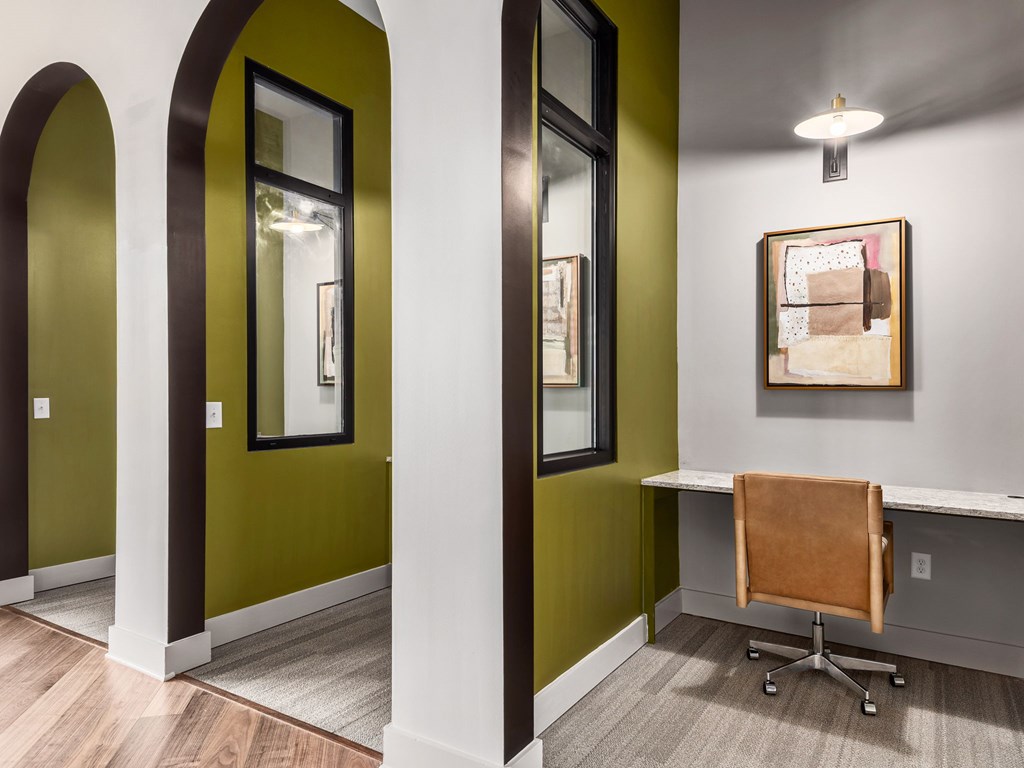 A room with a desk and a chair.