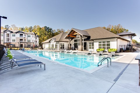 our apartments have a resort style pool with lounge chairs at The Laney, Augusta
