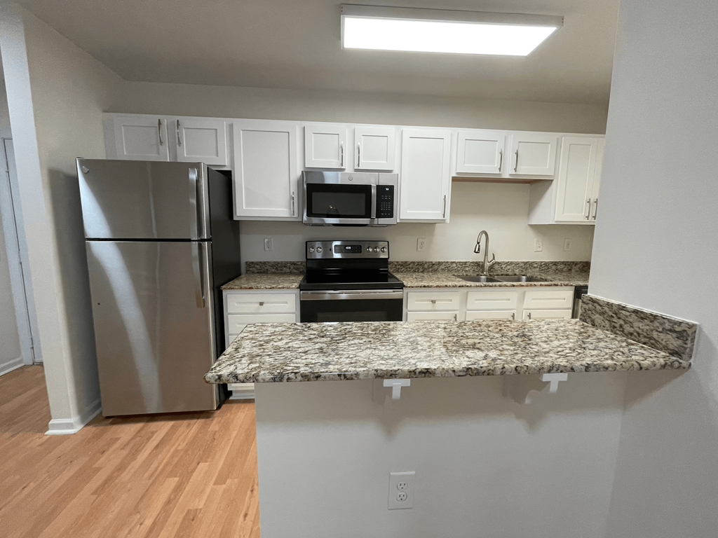 Kitchen with microwave at Oasis at Twinwood in Wilmington, NC