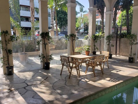 Outdoor seating area next to pool