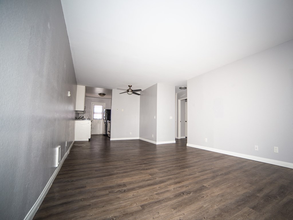 hardwood flooring and a ceiling fan