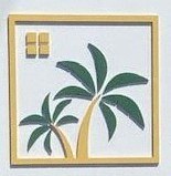 a picture of a palm tree in a gold frame