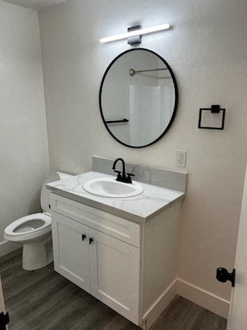 a bathroom with a white sink and a white toilet