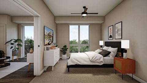 A bedroom with a large bed, a ceiling fan, and a painting on the wall.
