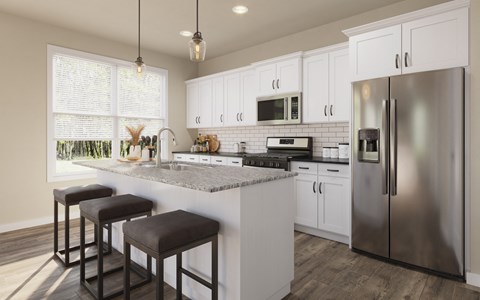 A kitchen with white cabinets and a granite countertop.
