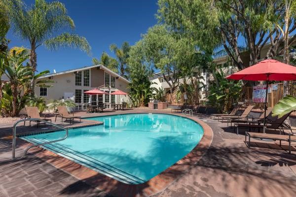 Campbell Plaza Apartments
710 Nido Drive, Campbell, CA 95008.  A red umbrella is next to a swimming pool.