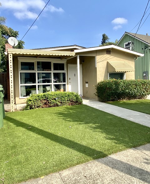 a house with a lawn in front of it