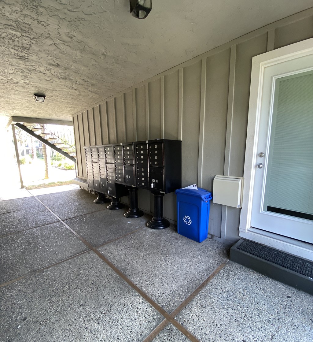 a row of refrigerators sit outside of a building