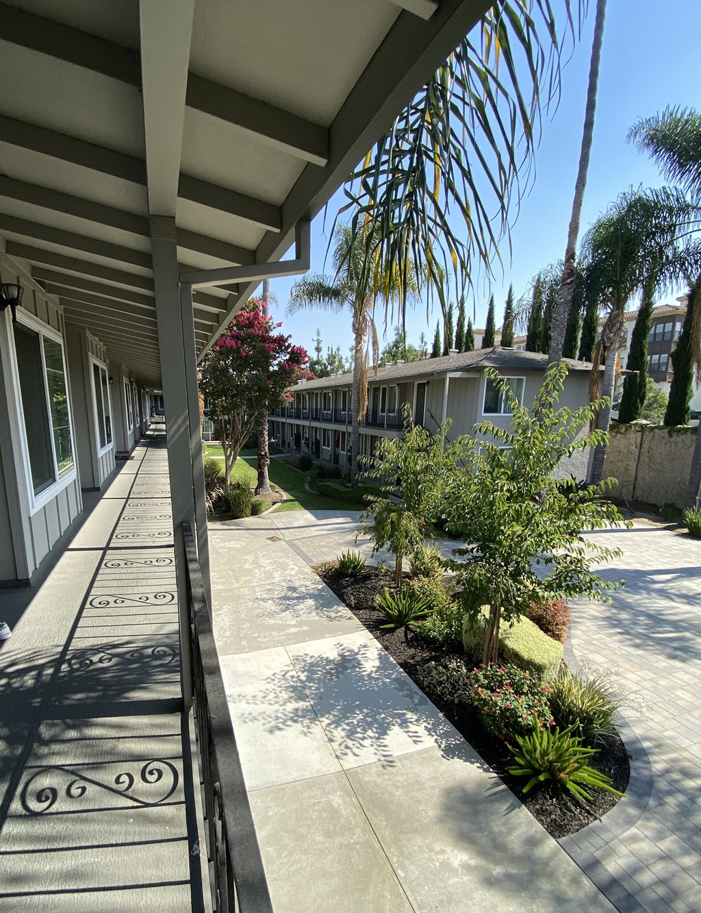 a view of the sidewalk in front of a building