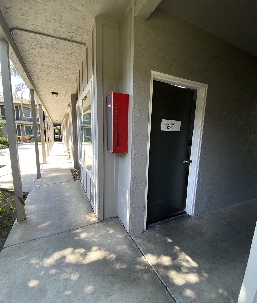 the door to the building is open and the hallway is empty