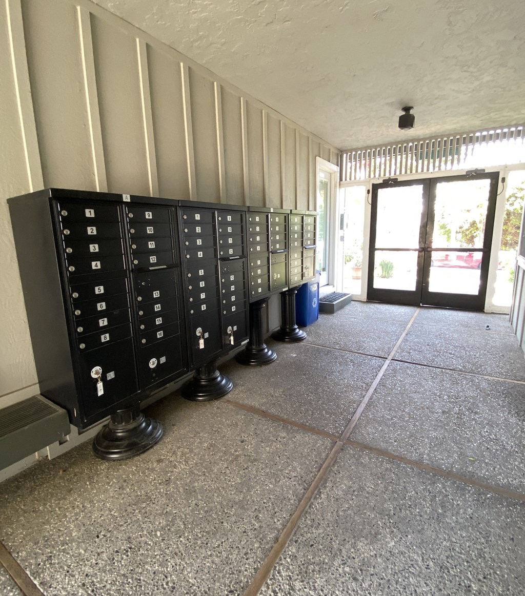 a view of the inside of a building with a row of cabinets on the floor
