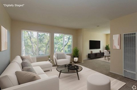 A modern living room with a large window and a flat screen TV.