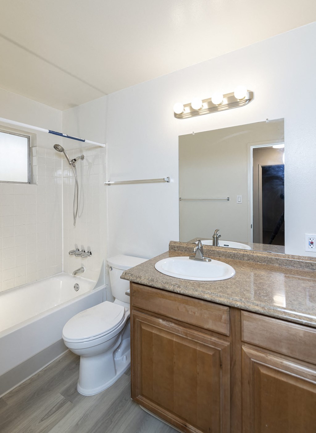 a bathroom with a sink toilet and a shower