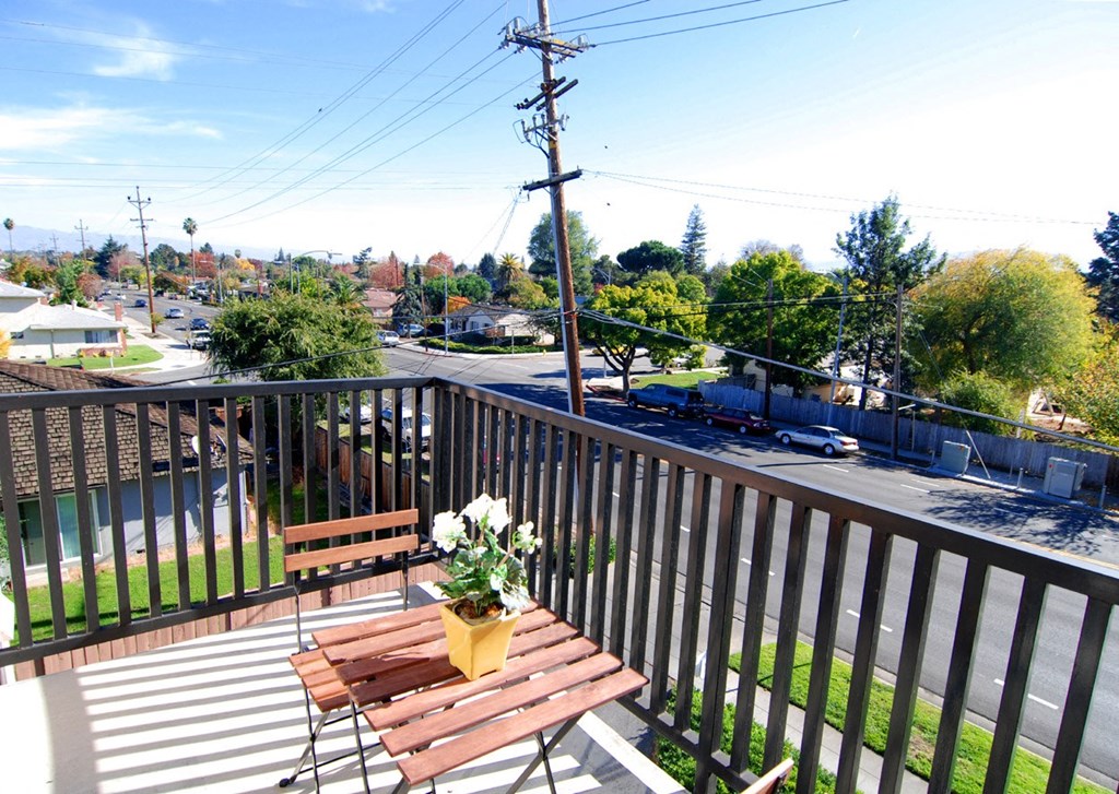 outdoor patio furniture a table with two chairs on the balcony overlooking the street at Prodesse Property Group 1211 Garbo Way  San Jose, CA 95117
