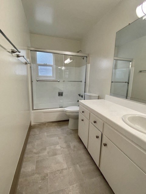 a bathroom with a sink toilet and a shower