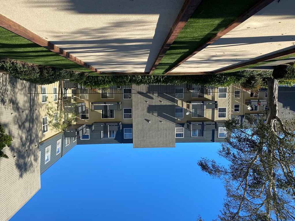 the reflection of an apartment building in the water