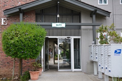 the front of a building with a glass door