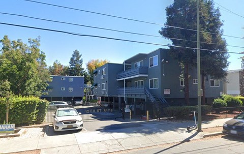 a row of houses on the corner of a street