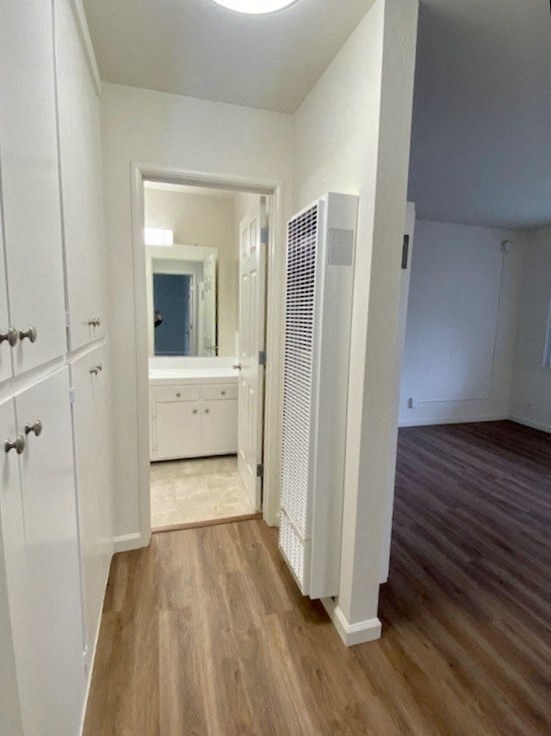 an empty room with a closet and a bathroom