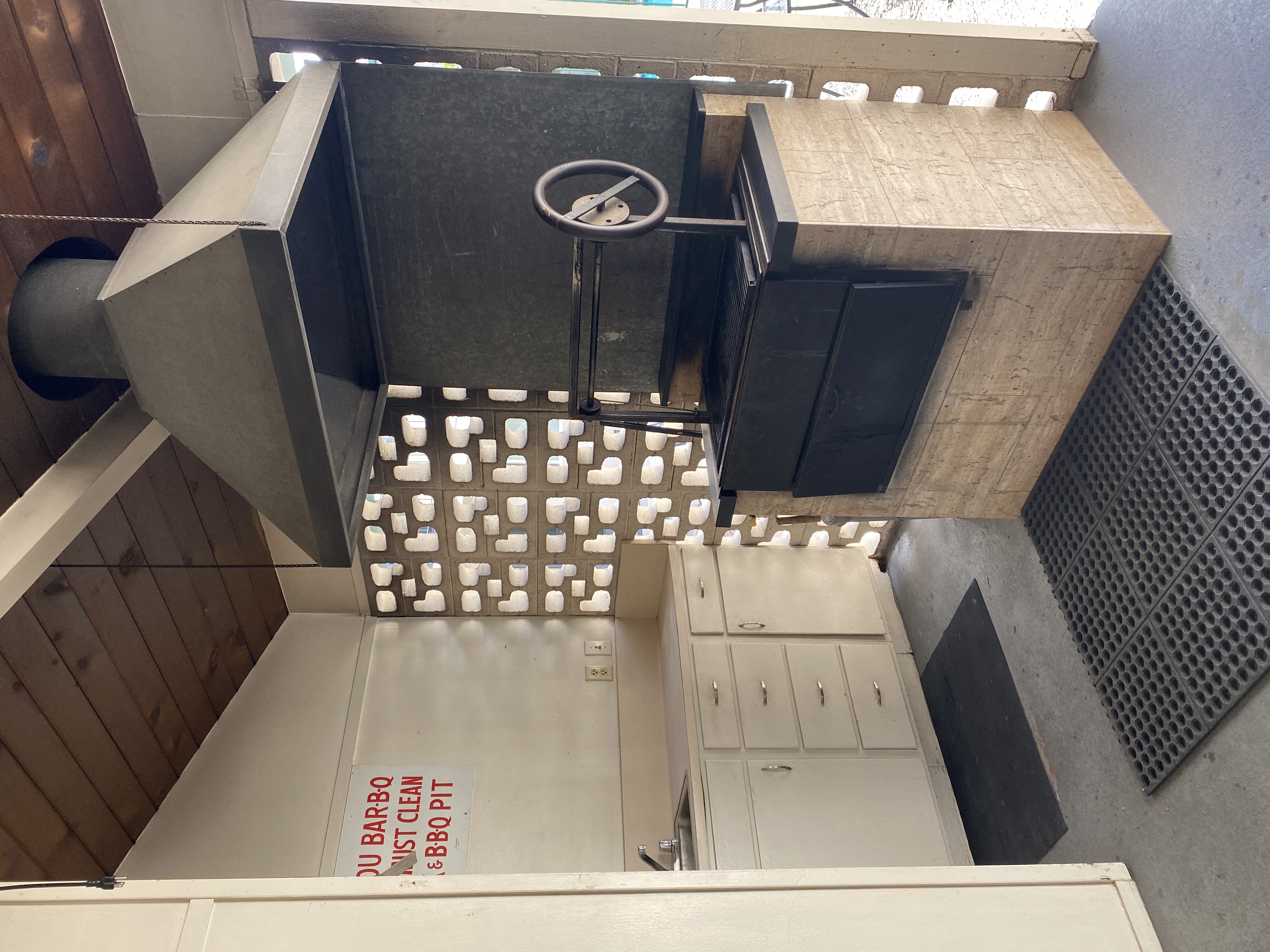 an overhead view of a kitchen with a sink and a faucet
