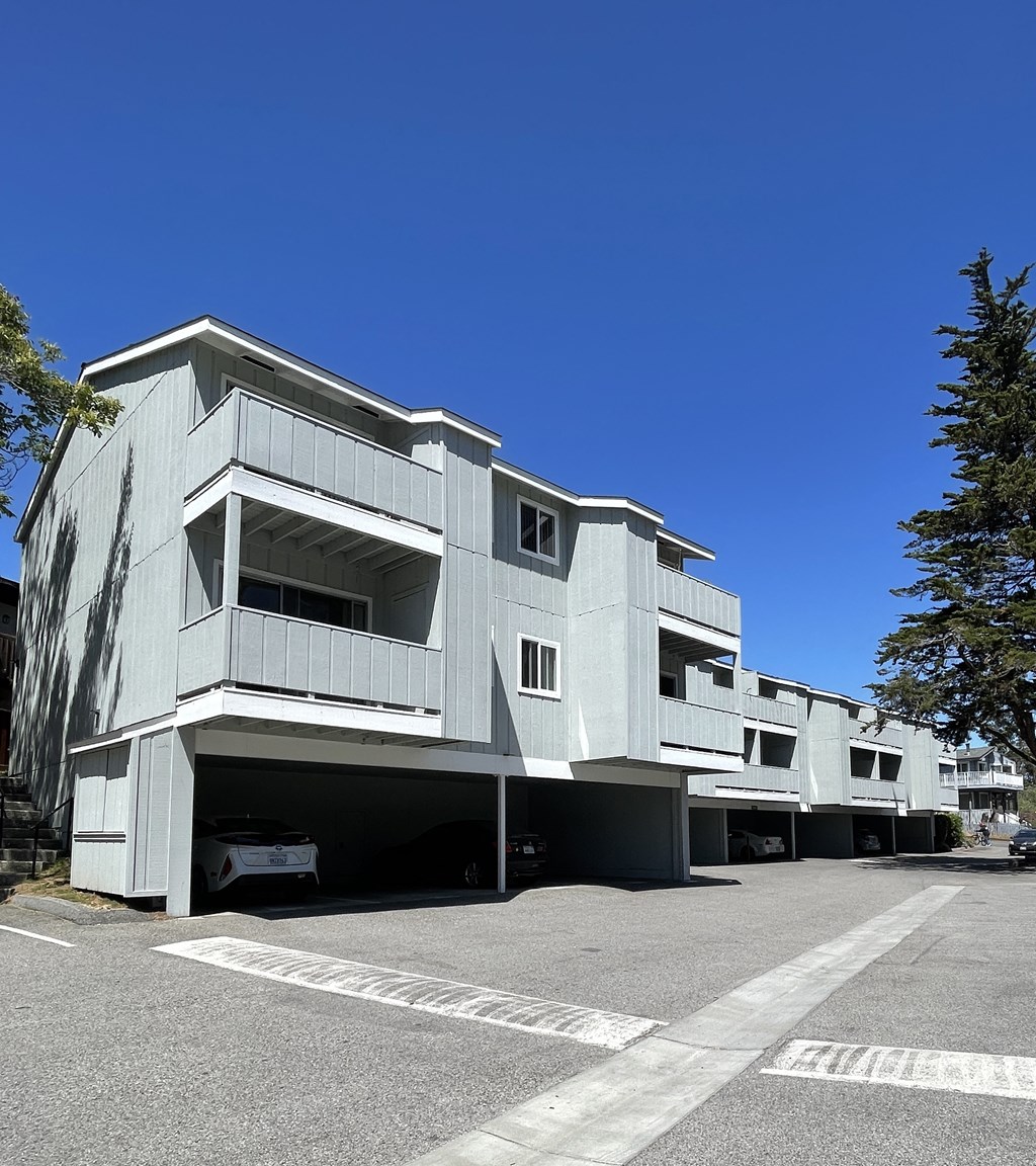 the side of a building with a street in front of it