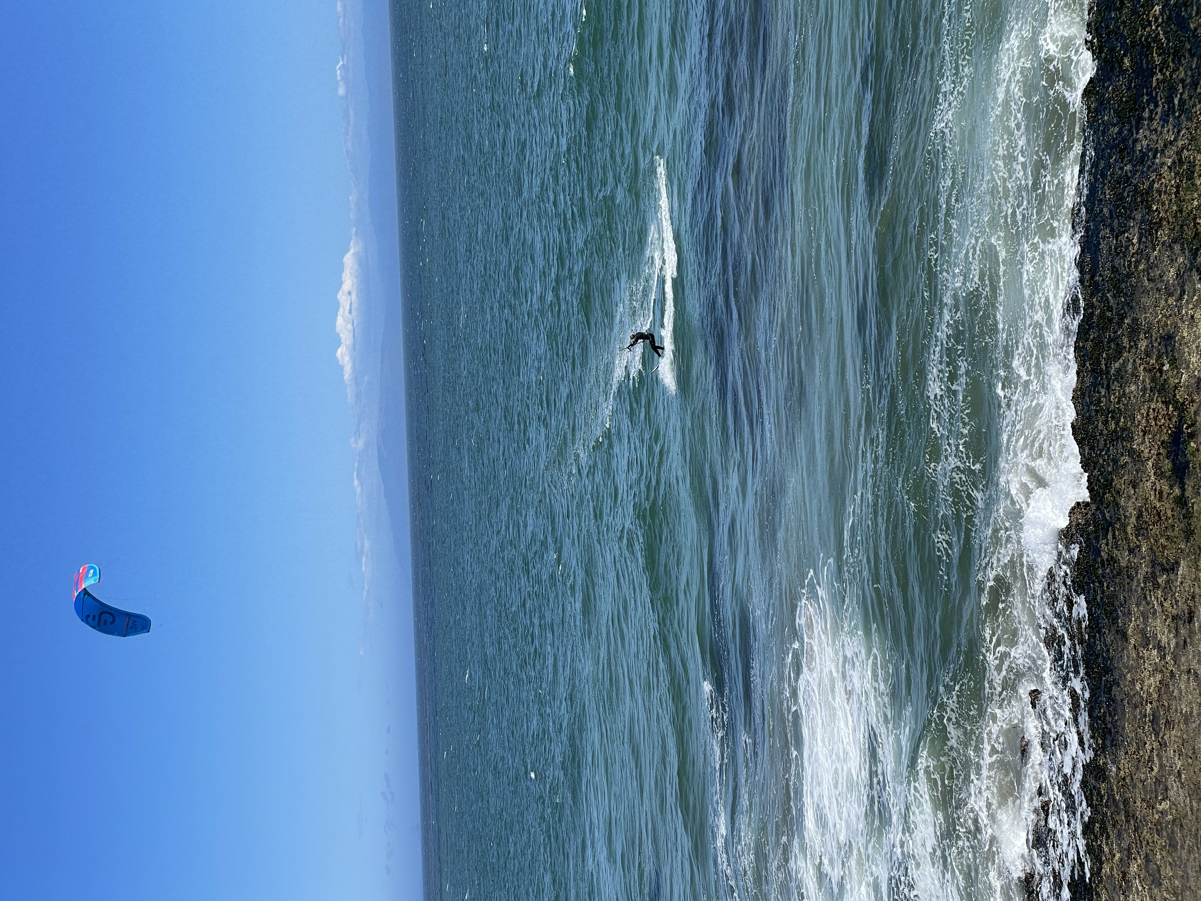 a man riding a wave on a surfboard in the ocean