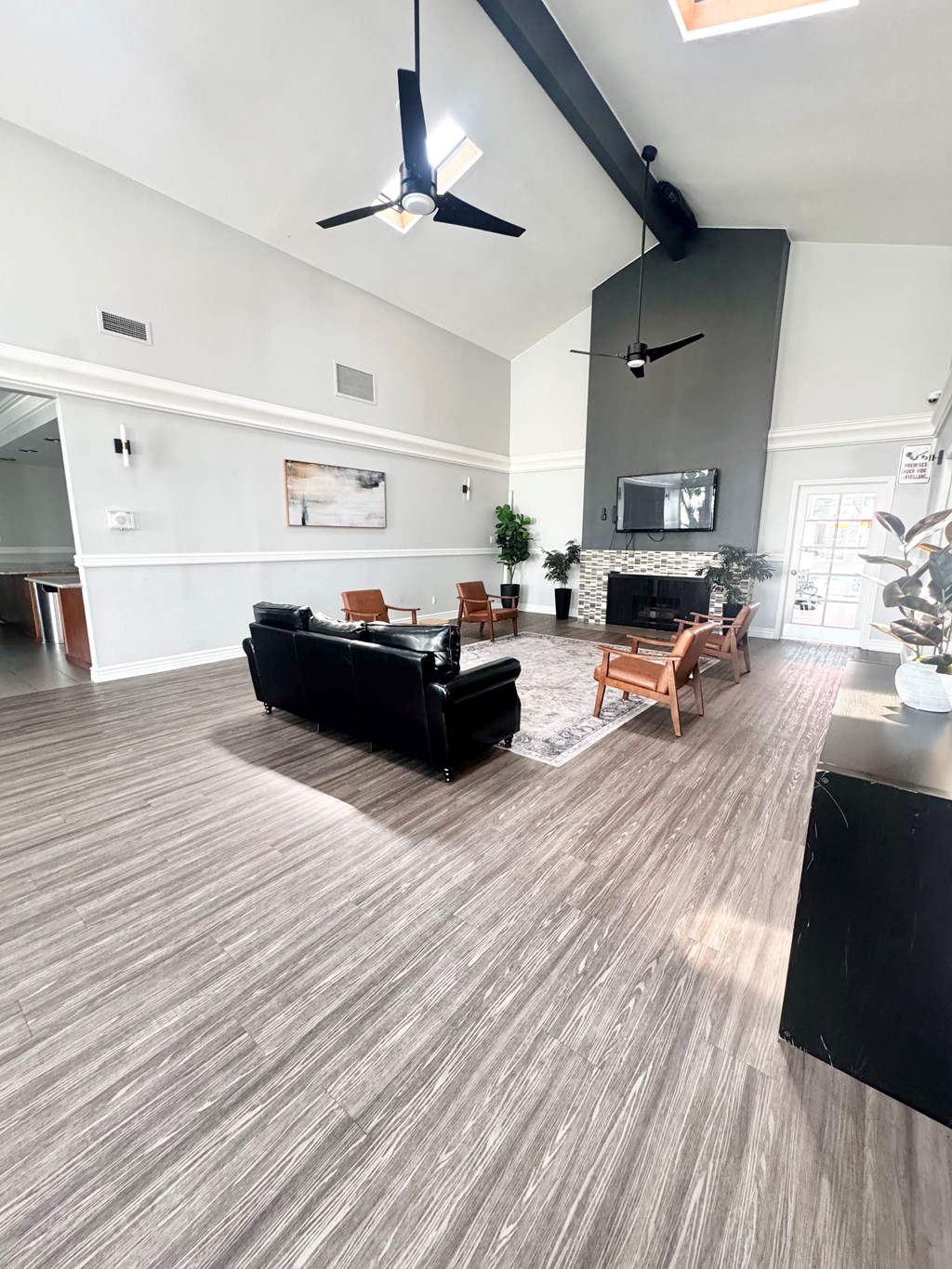 Campbell Plaza Apartments
710 Nido Drive, Campbell, CA 95008. A living room with a black couch and a fireplace.