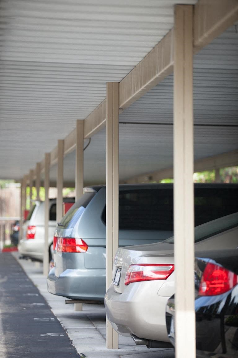 a row of cars parked in a parking lot