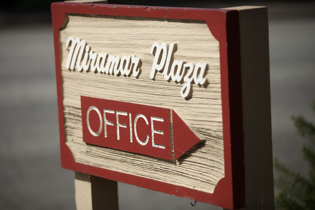 a red and white sign with the word office on it