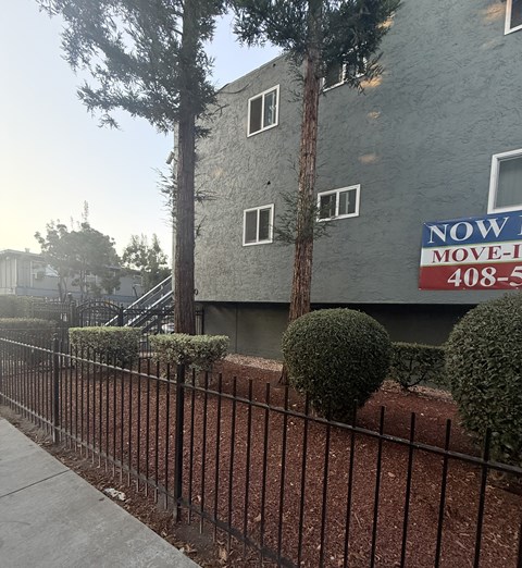 A sign on a building that says "NOW MOVE-IN" and the number "408-5".