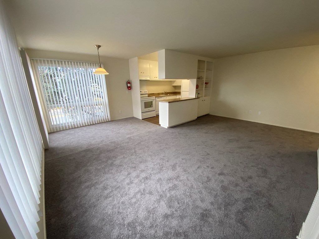 19th ave 2 bdrm Living Room with carpet flooring
