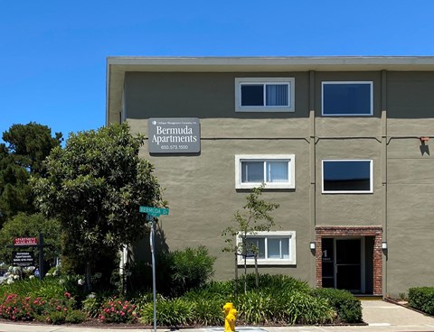 a building with a street sign in front of it