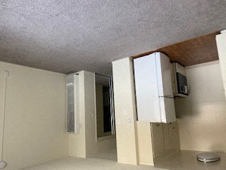 Bermuda apts- studio kitchen and living room view with a closet