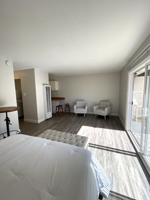 a view of the master bedroom and living room from the bed