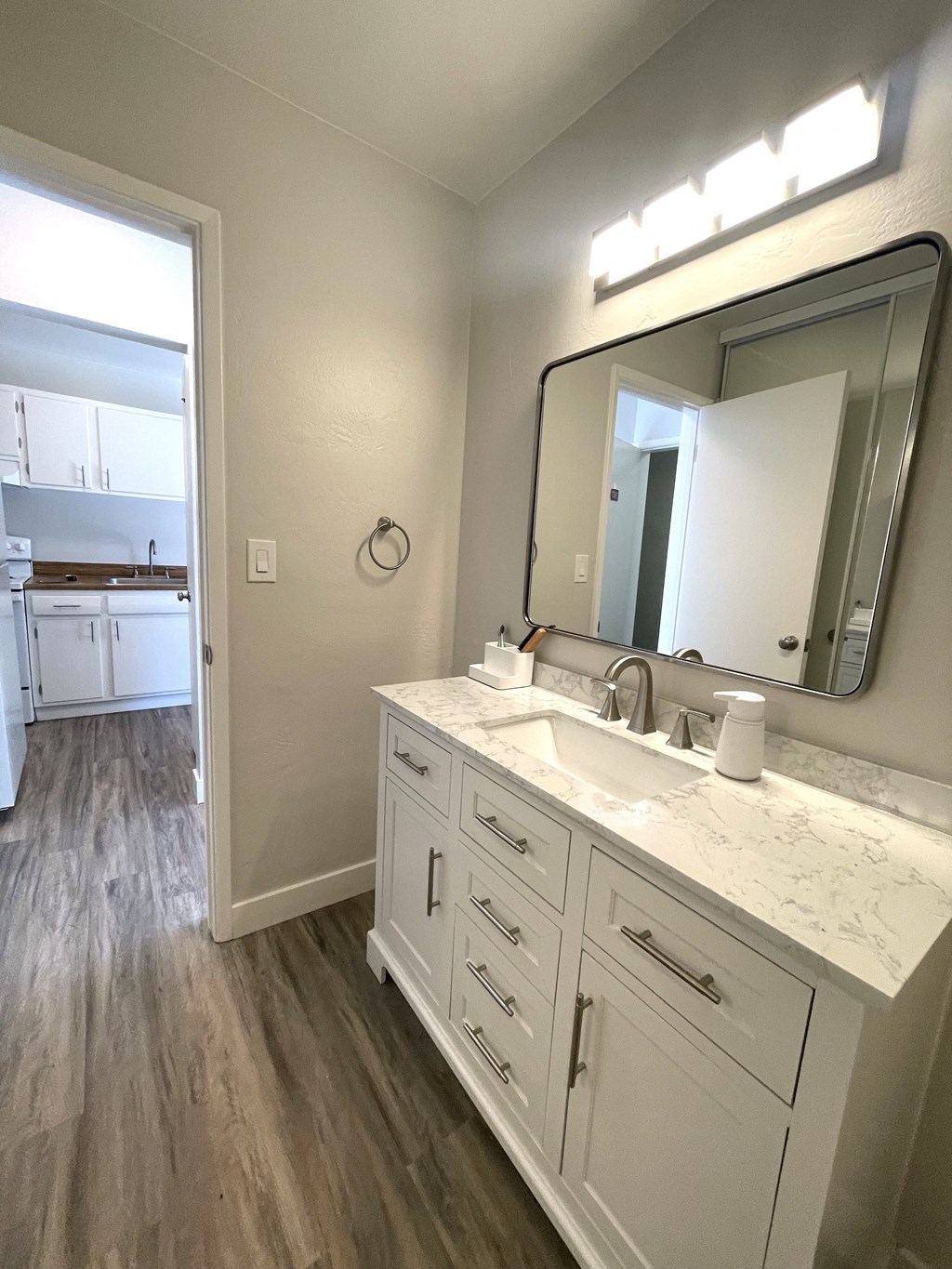 an empty bathroom with a sink and a mirror