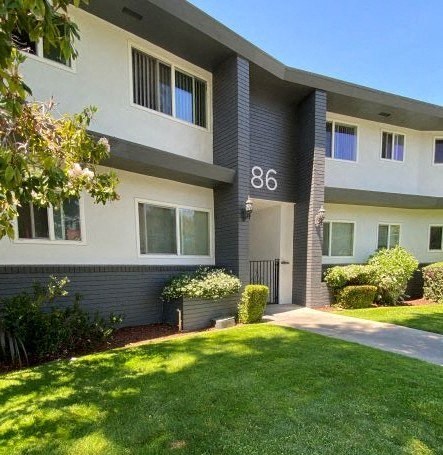 a large apartment building with a yard in front of it Intergritas Apartments 86 Renato Court  Redwood City, CA 94061 (650) 465-2410 Prodesse Property Group