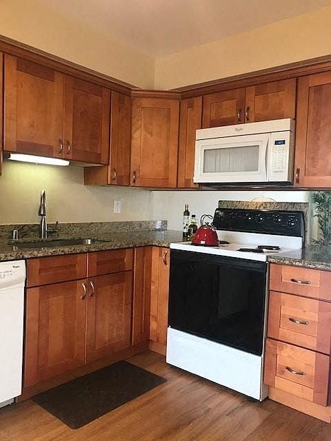 a kitchen with a stove and a microwave