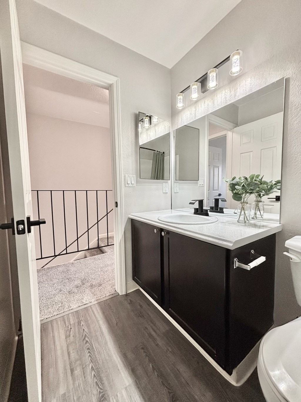 Campbell Plaza Apartments
710 Nido Drive, Campbell, CA 95008 A bathroom with a sink, mirror, and toilet.