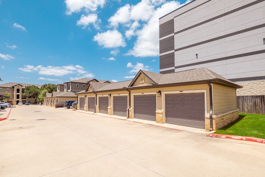a row of garages on the side of a building
