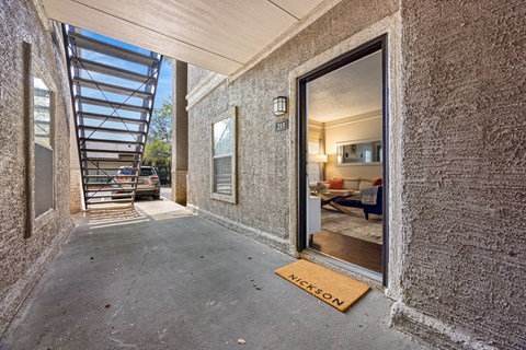 A hallway with a mat that says "Nickson" on it.