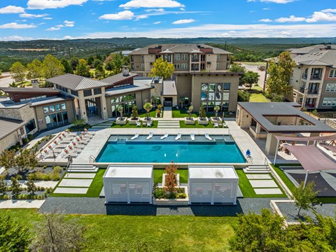 A large house with a pool in the backyard.